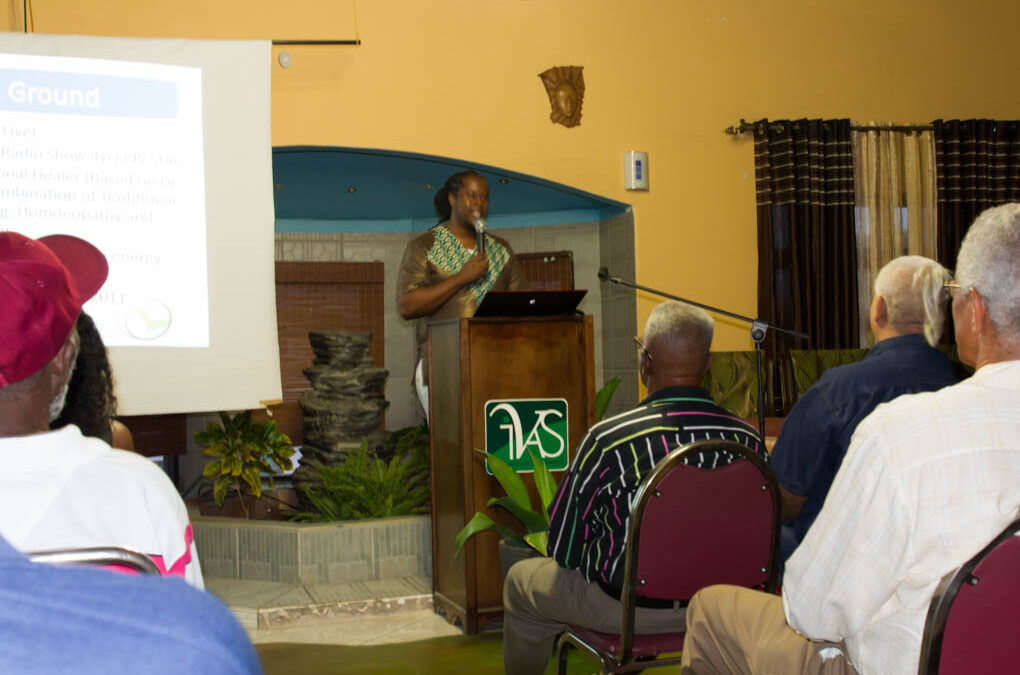 Uchenna Hackett (“Dr. Livet”) presenting at the conference