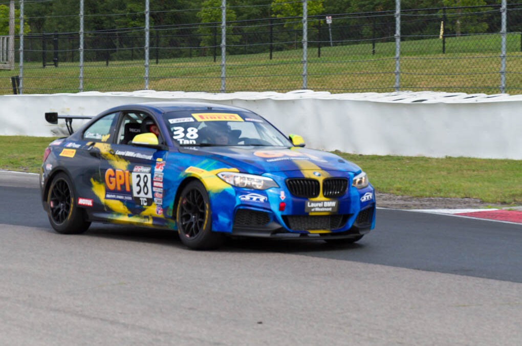 Dr. Andrews riding with race driver and driving instructor Pierre Savoy