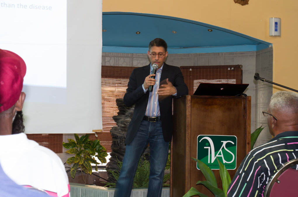 Dr. Khan presenting about non-toxic cancer therapies