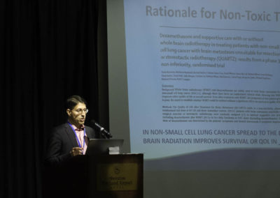 Dr. Akbar Khan presenting about non-toxic cancer therapies.