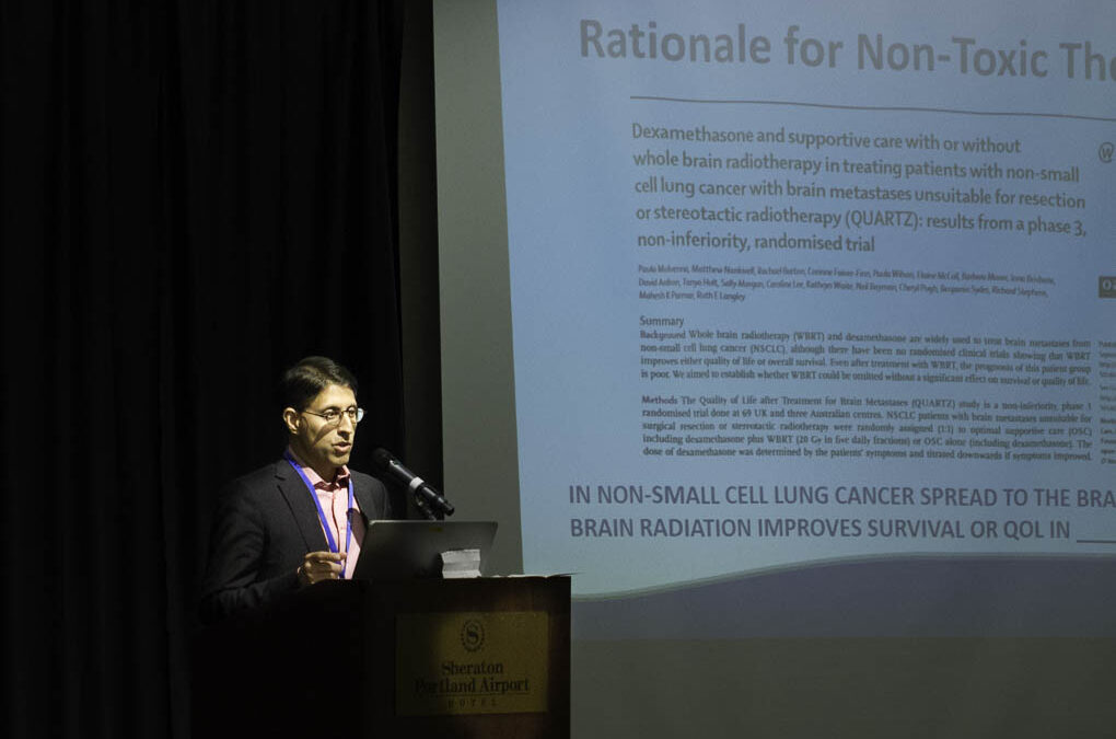 Dr. Akbar Khan presenting about non-toxic cancer therapies.