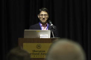 Dr. Khan challenging the audience with questions.