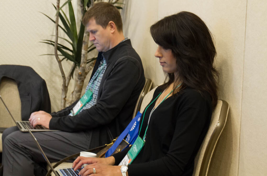 Dr. Dugald Seely and Dr. Sharon Gurm taking notes in an interesting lecture