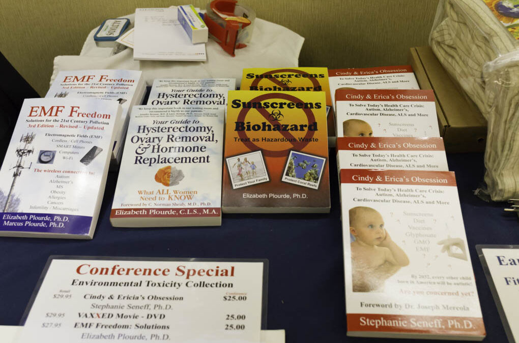 Books for sale about the hazards of sunscreen and EMF.