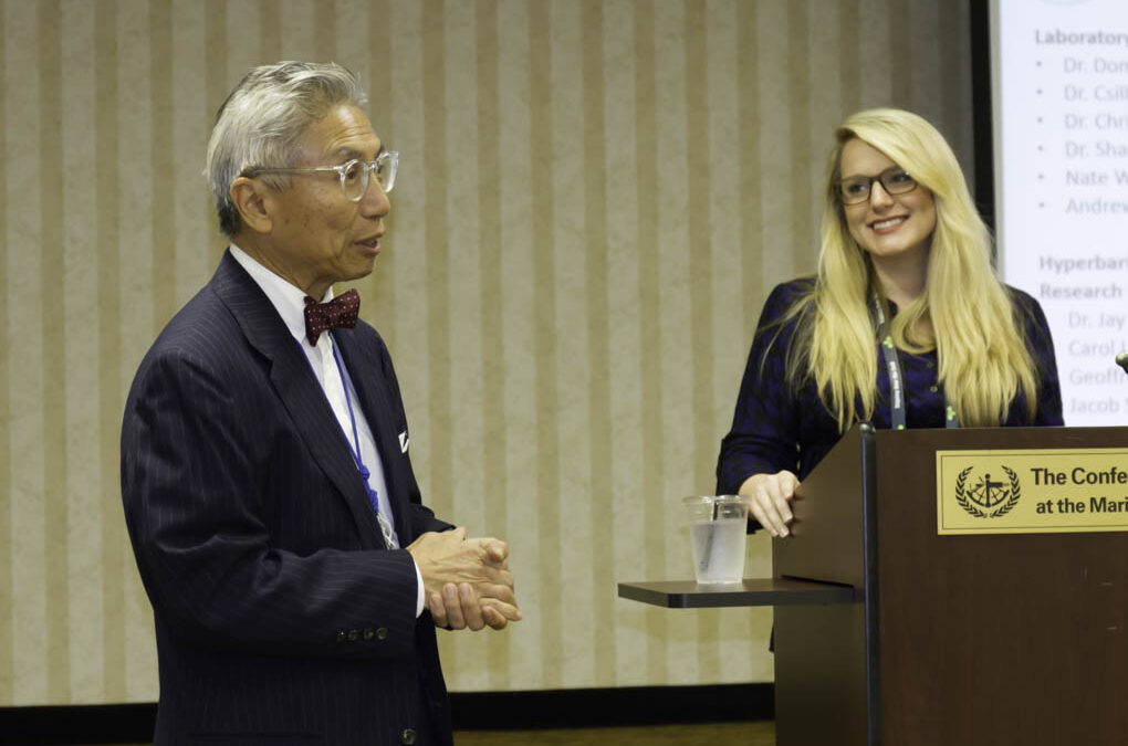 Dr. Yu taking audience questions with Dr. Poff.