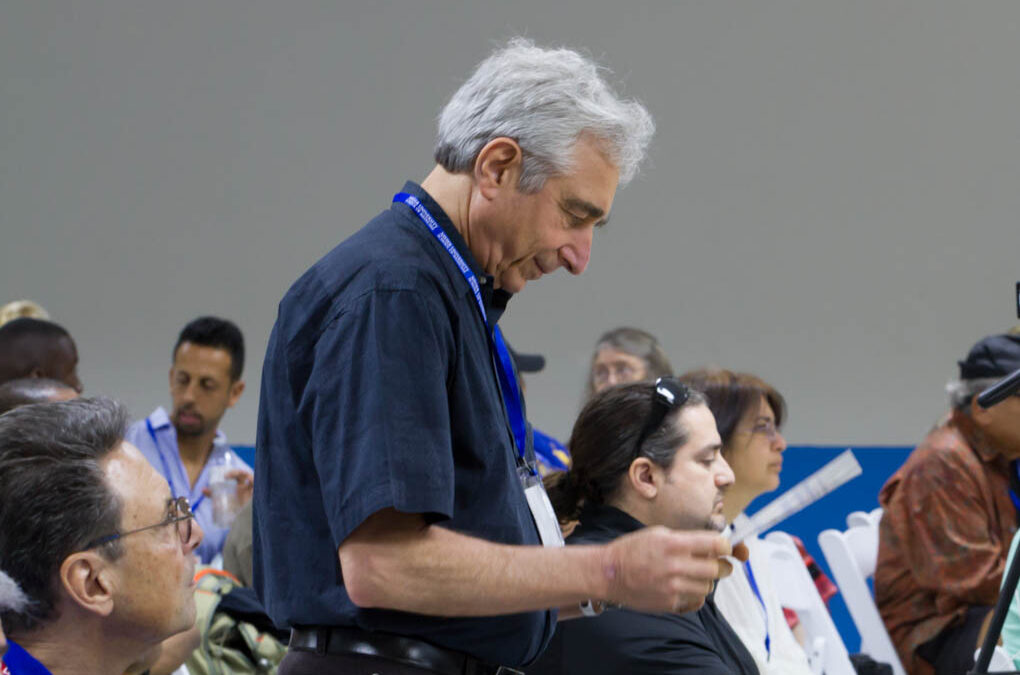 Dr. Robert Rowan, presenter and ozone expert, checking the conference schedule