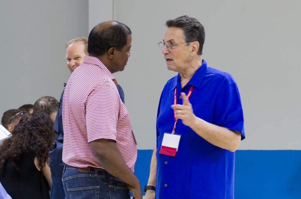 Dr. Howard Robins, presenter and ozone expert, engaging in discussion with one of the conference attendees